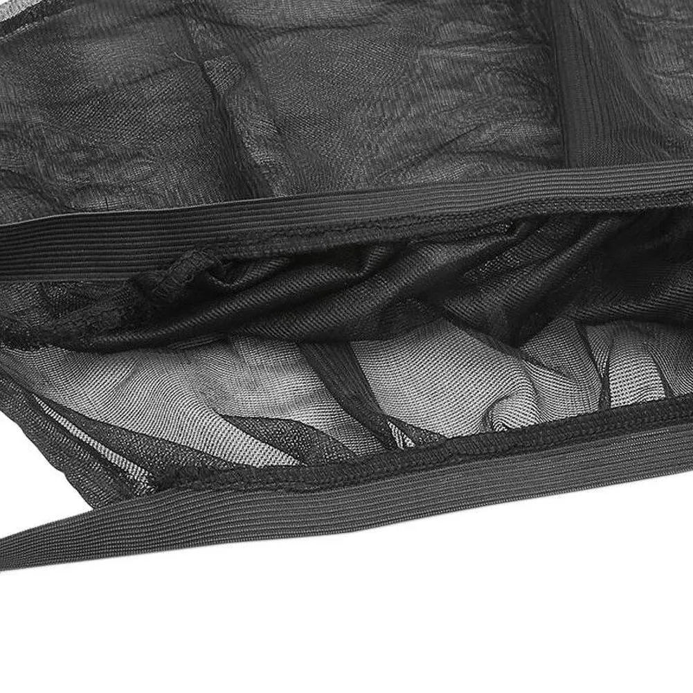 Elastic car side window sunshade made of grey mesh, stretched over a car window frame.