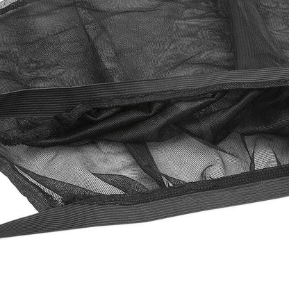 Elastic car side window sunshade made of grey mesh, stretched over a car window frame.