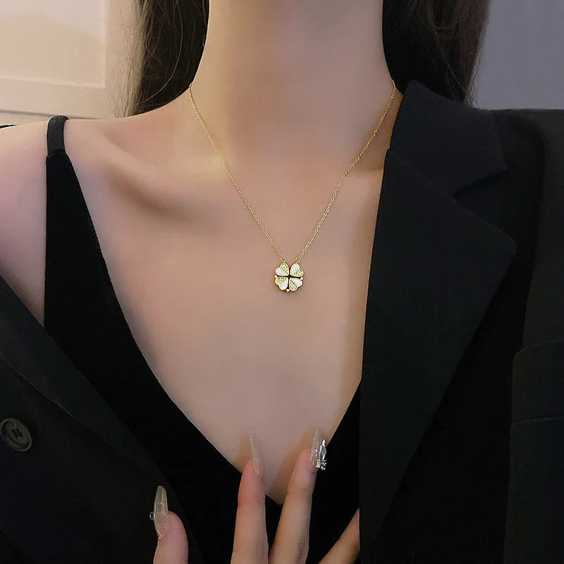 Exclusive four-leaf clover pendant necklace in stainless steel with crystal heart charm, a versatile jewellery piece for women