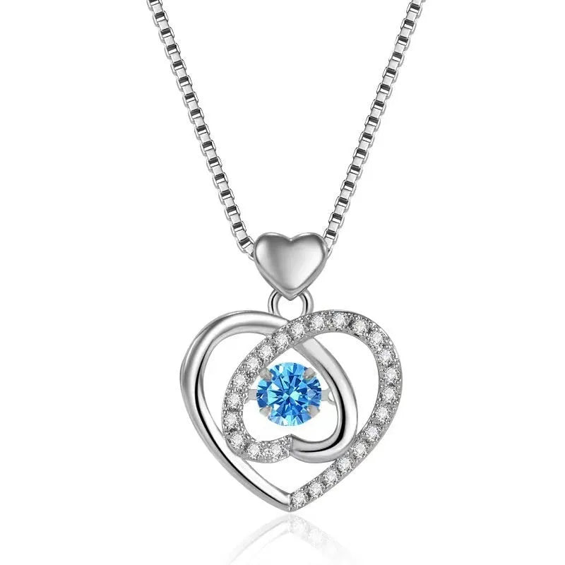 Blue diamond heart-shaped pendant necklace and matching bracelet set on a copper chain.