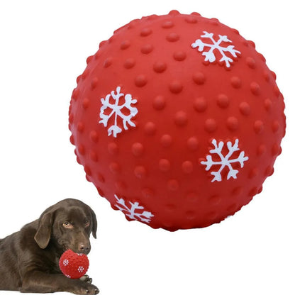 Red and green Christmas snowflake print dog chew ball with air vents, approx 7cm diameter.