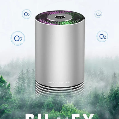 Compact black car air purifier with aluminium alloy and ABS construction, shown next to a car USB port.