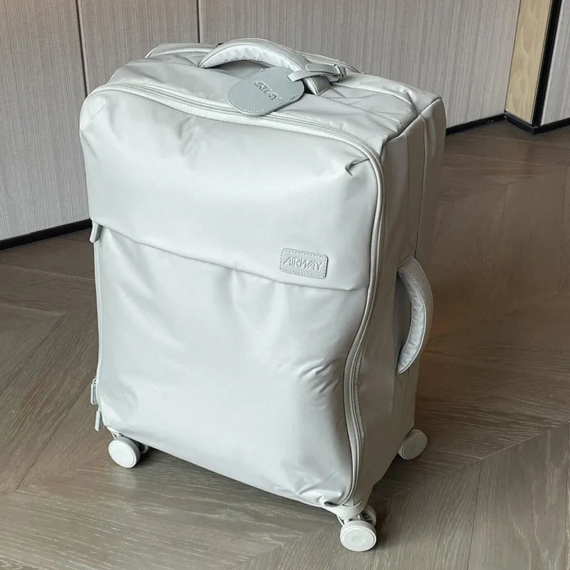 Ultra-light waterproof Oxford cloth suitcase in bluestone green with universal wheels showing 20-inch size dimensions