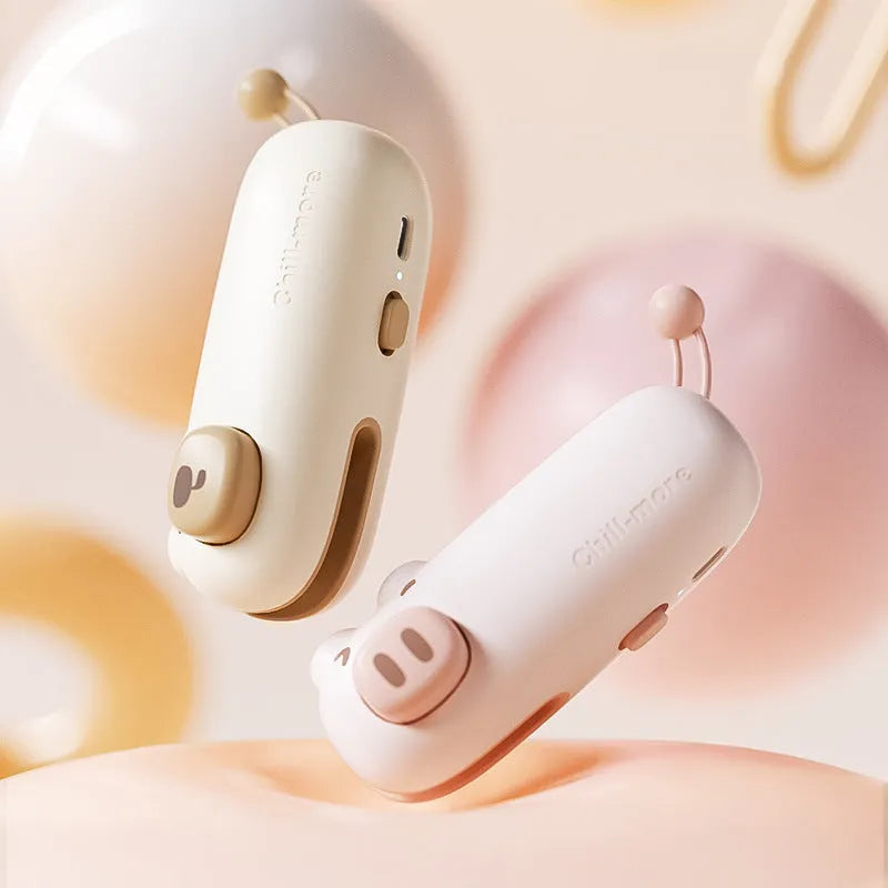 Pink handheld bag sealer machine with USB charging port and cartoon design