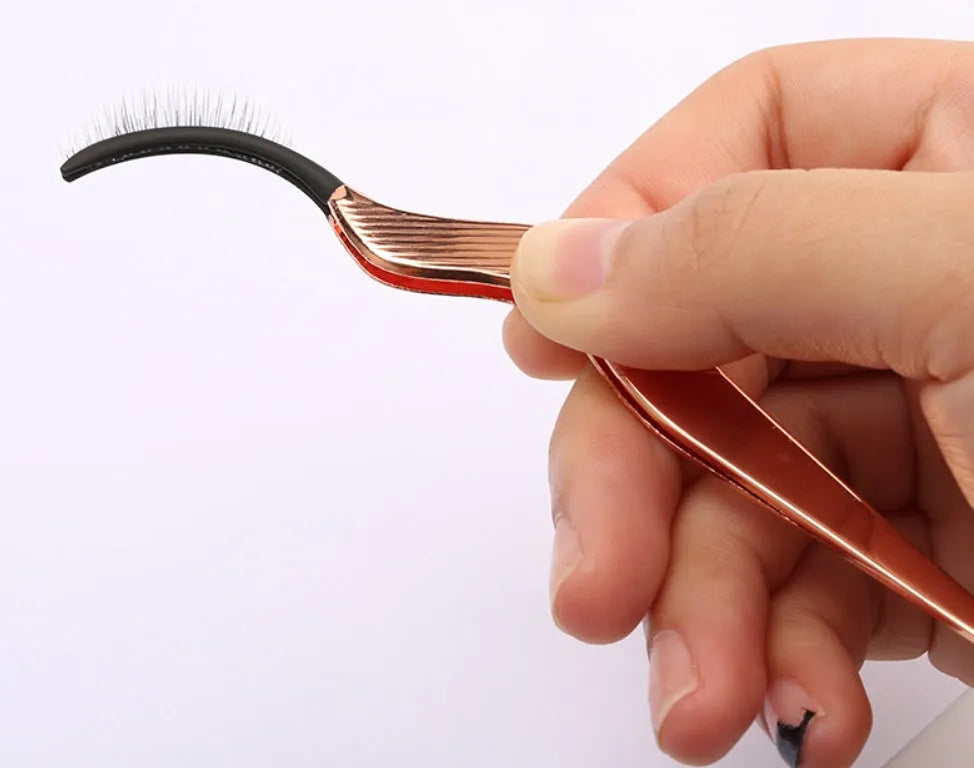 Rose gold eyelash curler aid for false eyelash application with gold colour option