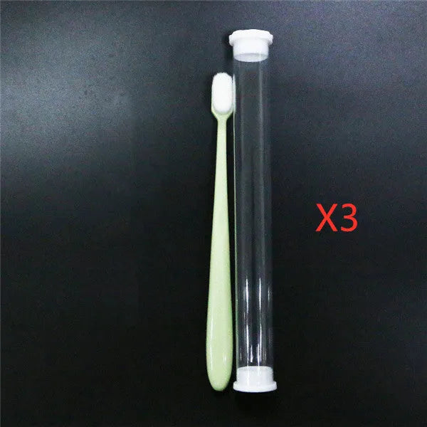 Micron soft toothbrush with coloured handles and different bristle styles including flat head and wavy designs