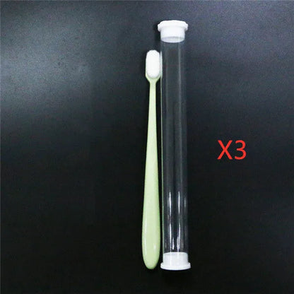Micron soft toothbrush with coloured handles and different bristle styles including flat head and wavy designs