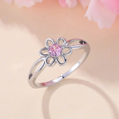 Women's flower hollow ring in pink diamond colour with floral design on copper band