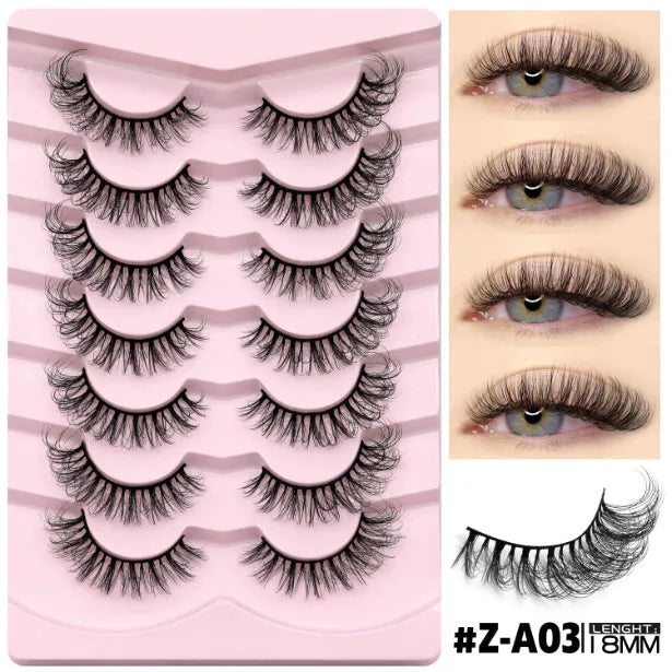 Box of natural false eyelashes in style A03 next to a tube of lash glue on a marble surface.