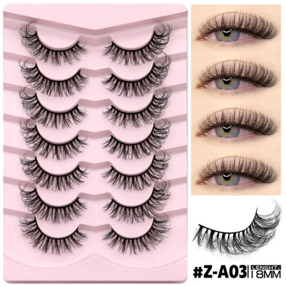 Box containing six pairs of black artificial fibre false eyelashes with different styles and a tube of clear lash glue.