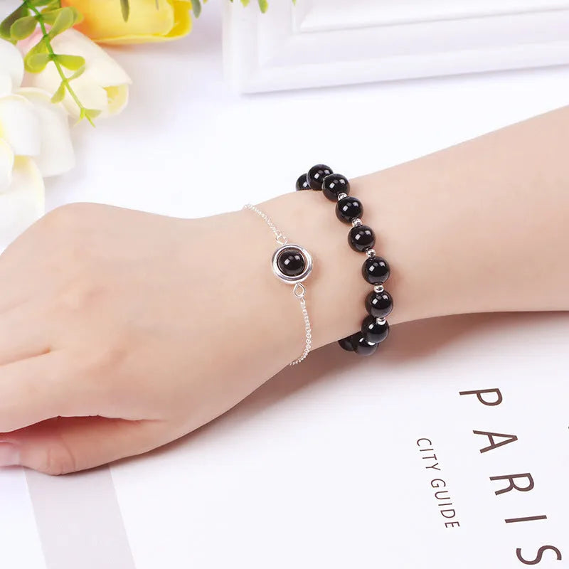 Double-layer women's bracelet with lucky beads and colourful crystals in gold-toned setting