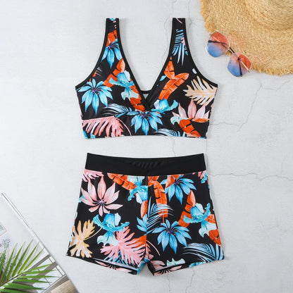 Women's two-piece swimsuit set showing sleeveless bikini top and printed boxer-style briefs in a multi-colour pattern.