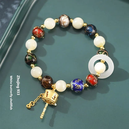 Hand-woven women's bracelet with grey coloured glaze sunstone beads and white lip shell beads
