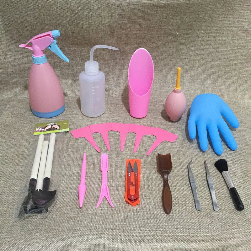 Succulent gardening tool set showing mini shovel, watering can, tweezers, and rake on a table.