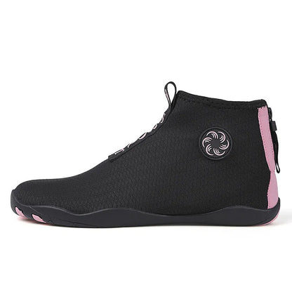 Mid-top outdoor beach shoes in black and fluorescent green with mesh upper and rubber sole.