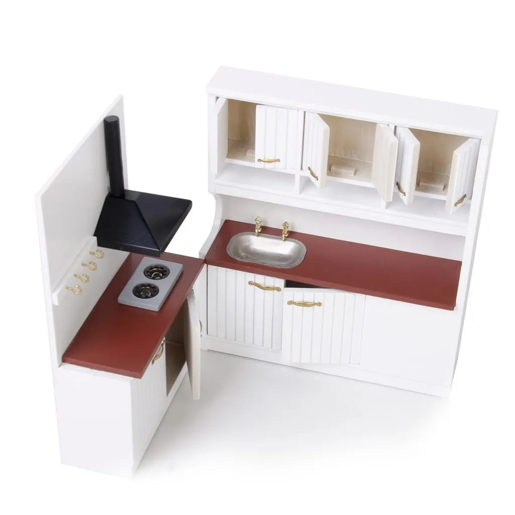 White dollhouse kitchen sink and stove cabinets with working doors and metal handles.