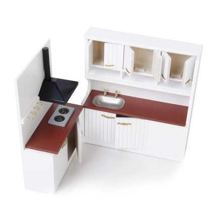 White dollhouse kitchen sink and stove cabinets with working doors and metal handles.