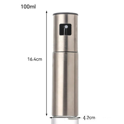 Glass oil spray bottle with stainless steel press cap showing 100ml capacity