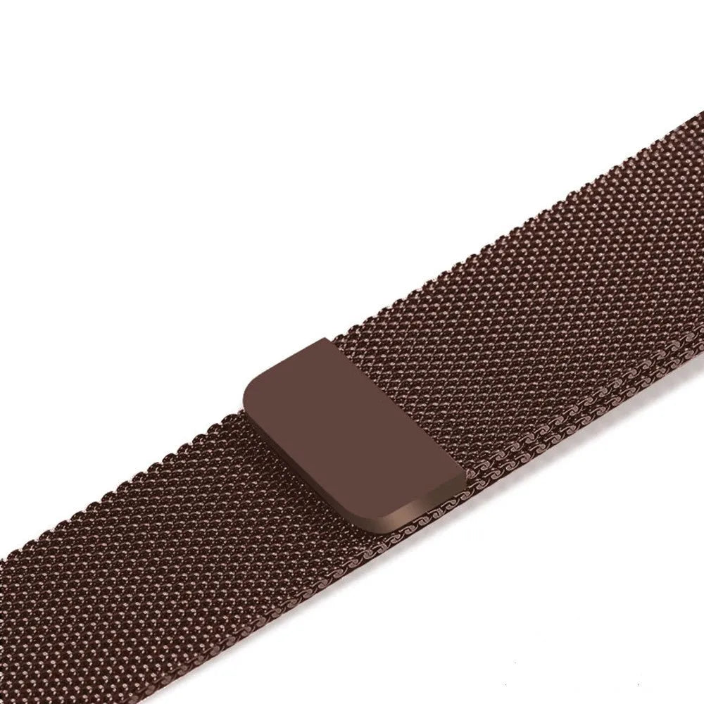 Stainless steel Apple Watch strap in silver on a wrist, showing the metal links and secure clasp.