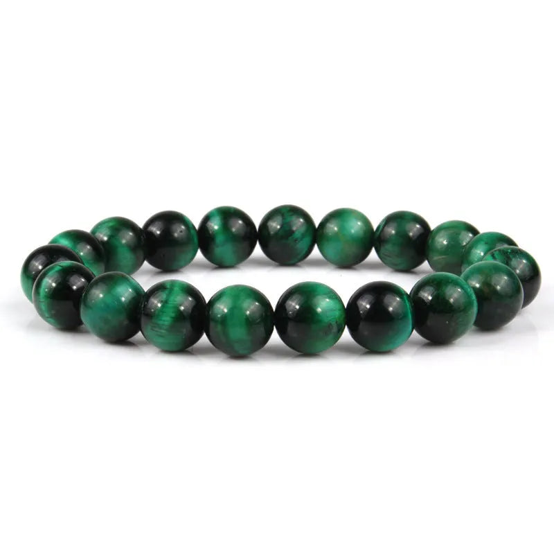 Natural tiger eye crystal bead bracelet showing round geometric beads on a wrist, available in multiple sizes and colour variations.