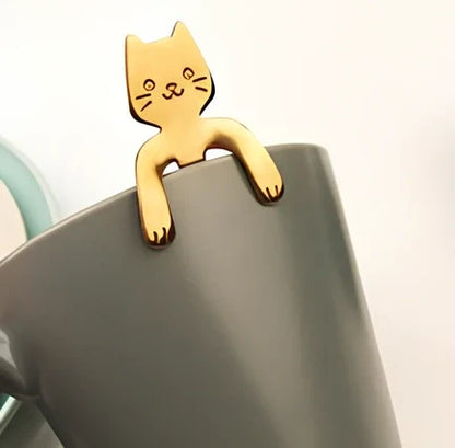 Stainless steel coffee spoon with cartoon cat handle showing hanging hole and smooth edges