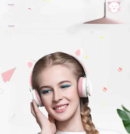 Pink and white wireless Bluetooth headset with head-mounted design and 40mm speakers