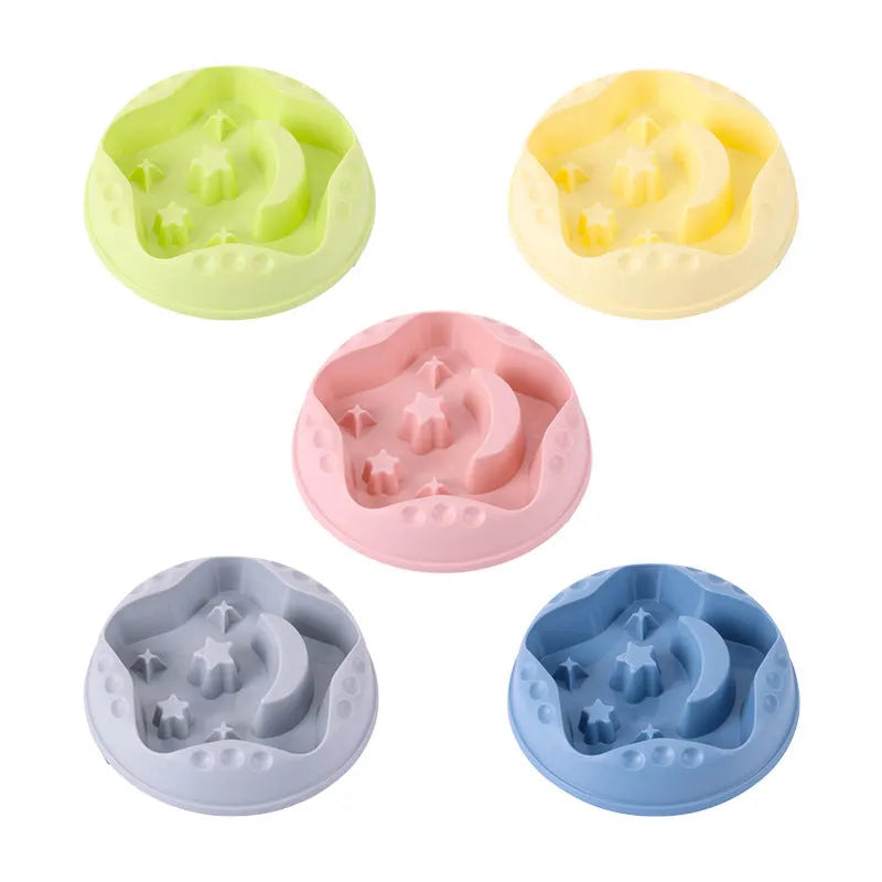 Blue slow feeder dog bowl with raised moon and star patterns inside, non-slip base