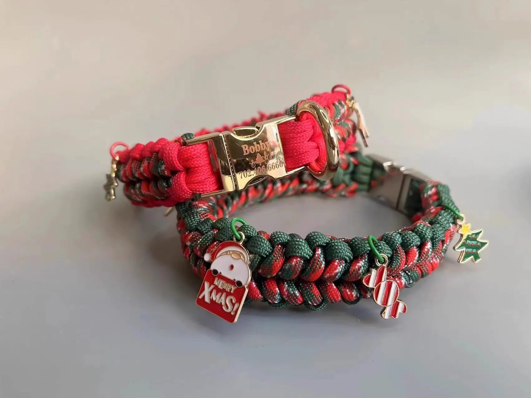 Green rope dog leash with P chain and a metal release buckle, held in a person's hand.