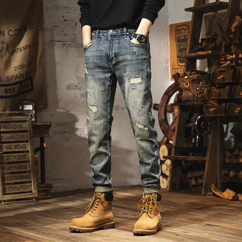 Men's vintage blue straight-leg jeans with a fleece lining and drawstring waist closure.