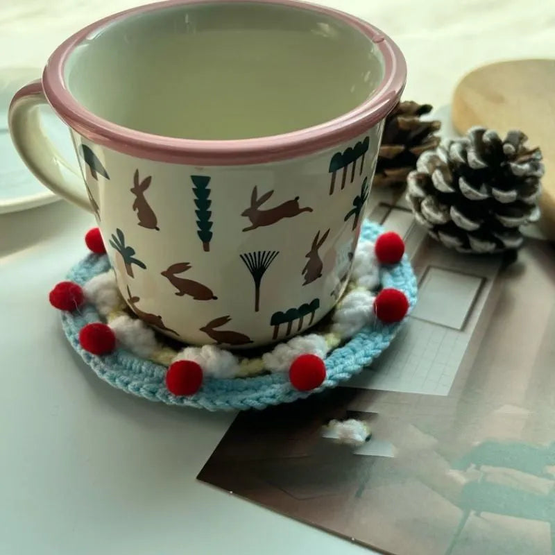 Finished wool crochet coaster bag with cake design measuring 9cm diameter