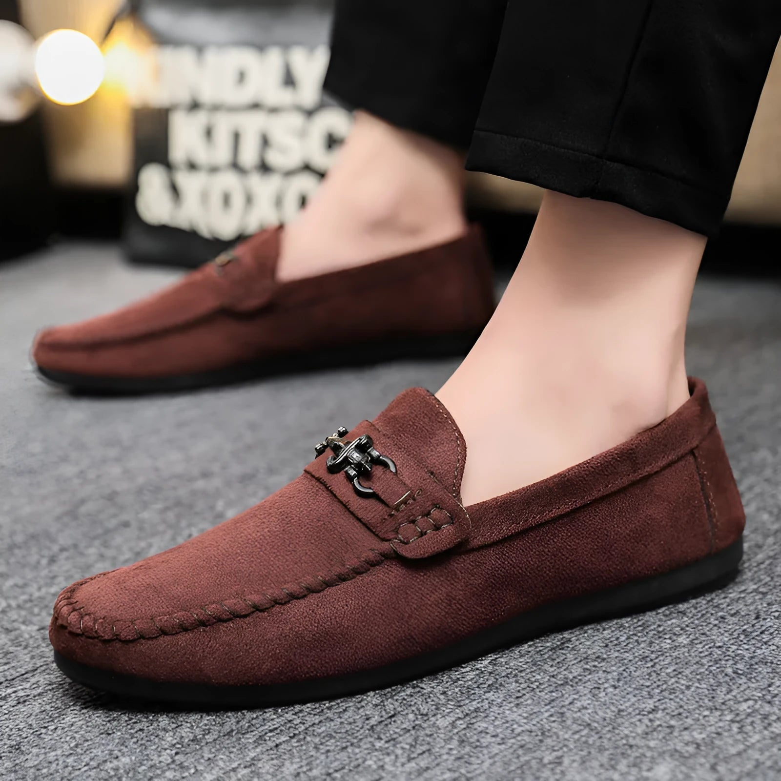 Men's black waterproof slip-on loafers with round toe and low heel on a rubber sole.