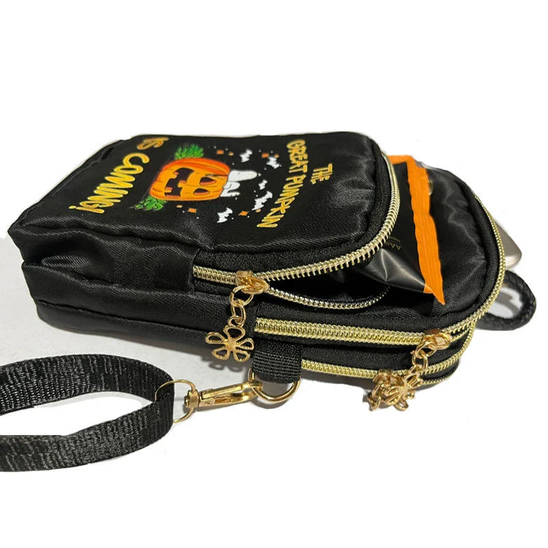 A black crossbody bag with a pumpkin pattern, perfect for Halloween celebrations and everyday use.