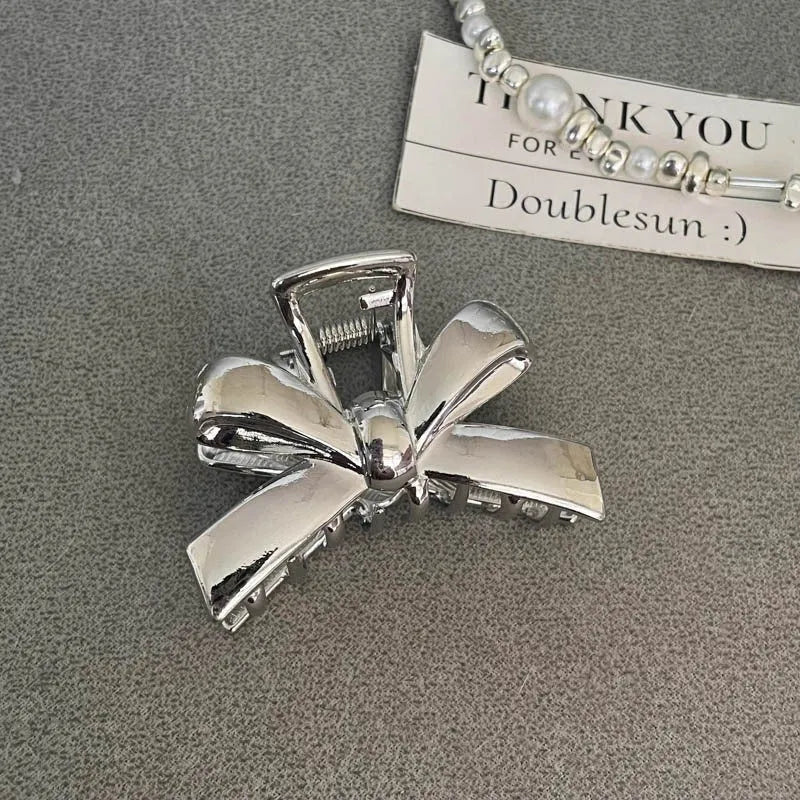 Silver metal hair claw barrette example from a range of 44 Korean-style designs.