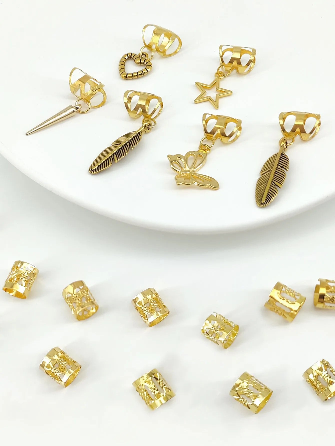 Pack of 26 antique-style dirty braid hair rings in alloy metal with gold electroplated finish.