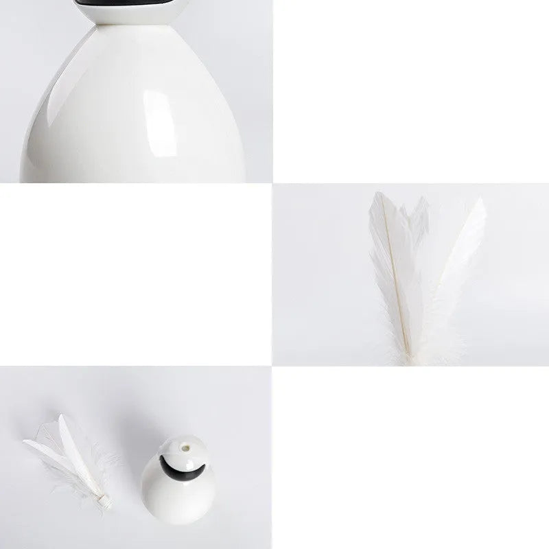 Tumbler cat toy in white, yellow, or pink with ABS body and feather replacement pieces.