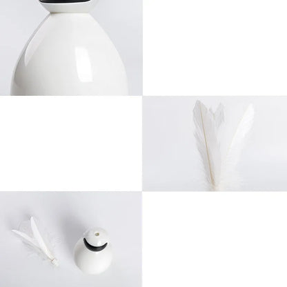 Tumbler cat toy in white, yellow, or pink with ABS body and feather replacement pieces.