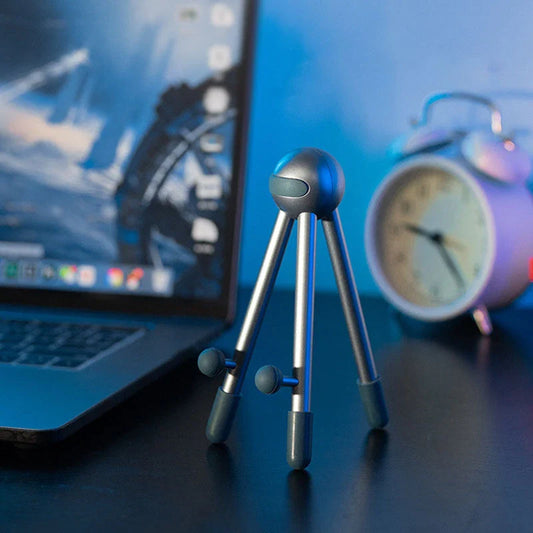 Adjustable desk stand in pink and green alien-inspired designs, featuring a mobile phone and tablet holder with 120-degree angle adjustment