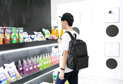 Black men's waterproof travel backpack showing computer pocket and double shoulder straps