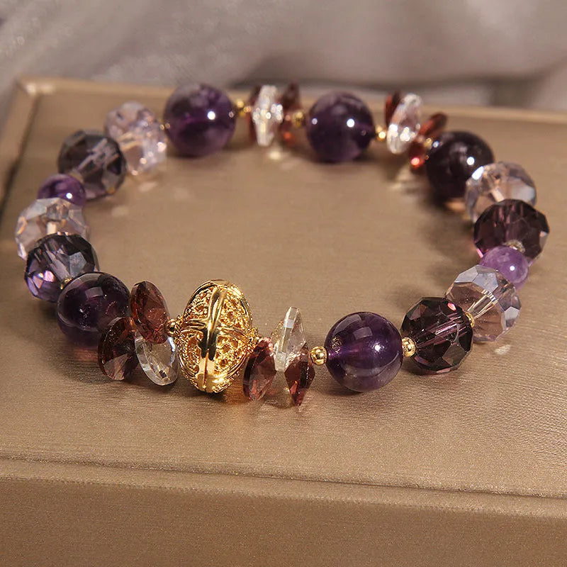 Purple crystal bracelet with pumpkin beads and rhinestone decoration