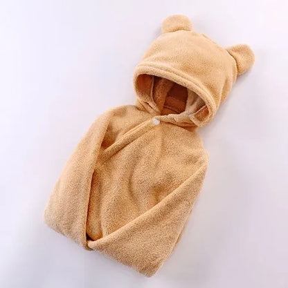 Blue hooded baby bath towel with dimensions 65cm by 110cm laid flat.