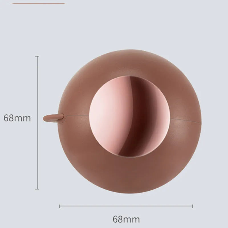 Reusable gel lint roller ball in green gold colour for removing pet hair and lint from fabrics.
