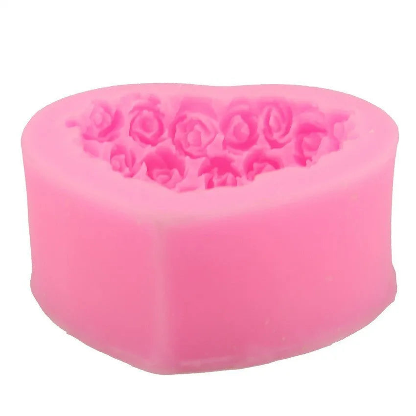 Pink silicone heart-shaped mould with a love design for Valentine's Day crafting.