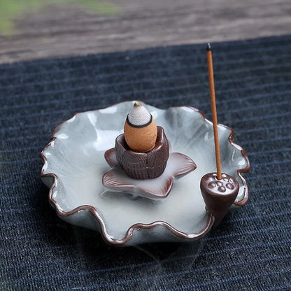 Square ceramic incense burner with reverse flow design showing smoke cascading down sides, Ge kiln crackle glaze patterns visible