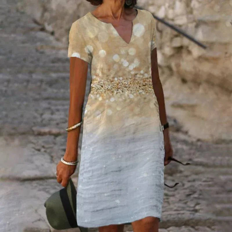 Elegant floral-printed cotton and linen midi dress in various colours with short sleeves and v-neck
