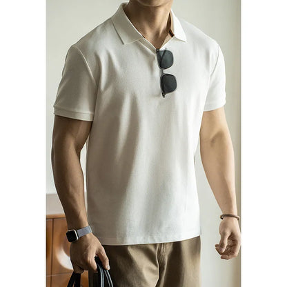 American-style cotton polo shirt in blue, black or white with short sleeves and regular fit