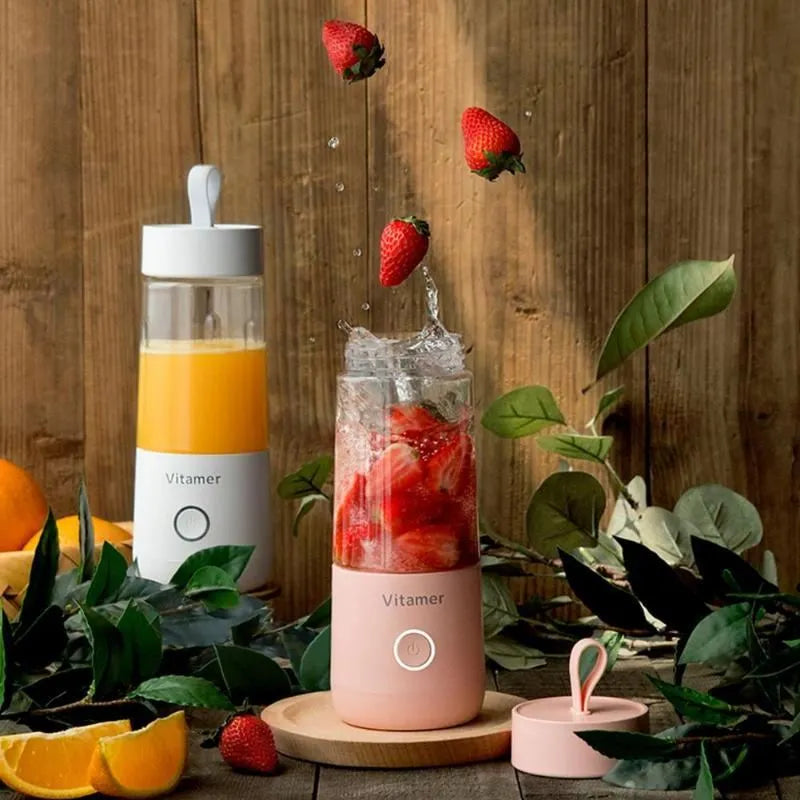 White portable USB rechargeable blender bottle with silicone handle on a Tritan cup.