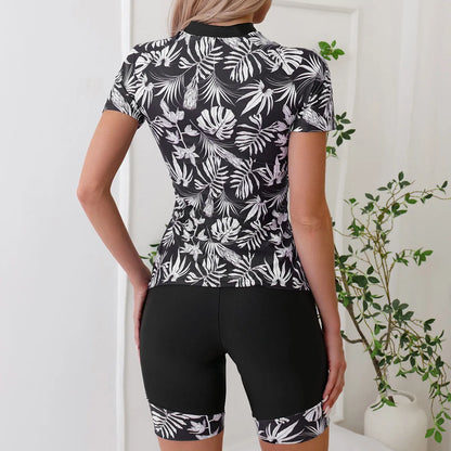 Women's printed floral swimsuit set with front zipper and matching shorts in black or navy blue