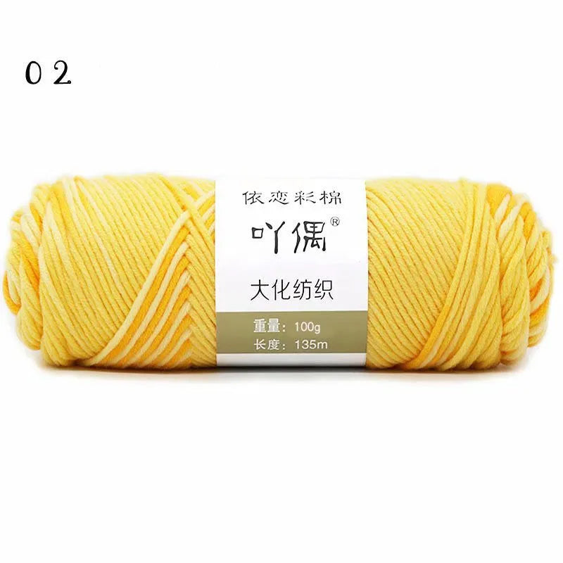 Eight strands of gradient milk cotton wool in a ball, showing multiple colour options for hand knitting.
