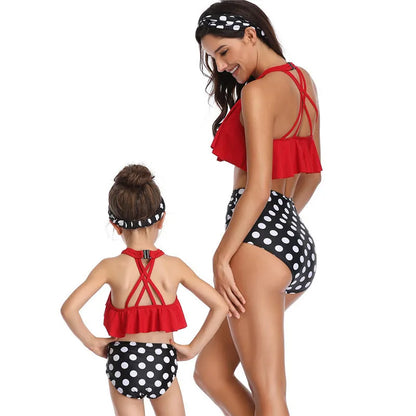 Nylon one-piece swimsuit with chest pad, available in flower, orange, and red, adult and child sizes.