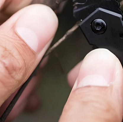 Black pocket folding knife with serrated blade, shown open at 85mm length and closed at 5mm thickness